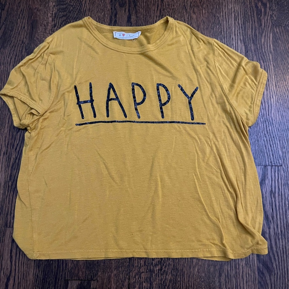 yellow “happy” shirt